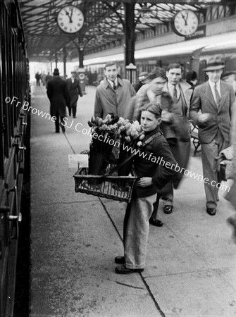 BOY SELLING FLOWERS